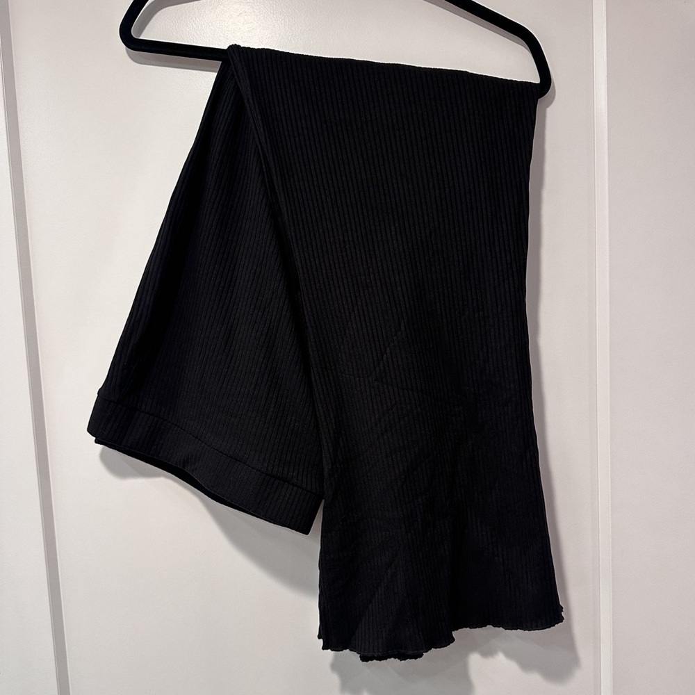 Black ribbed flare pants with lettuce hem